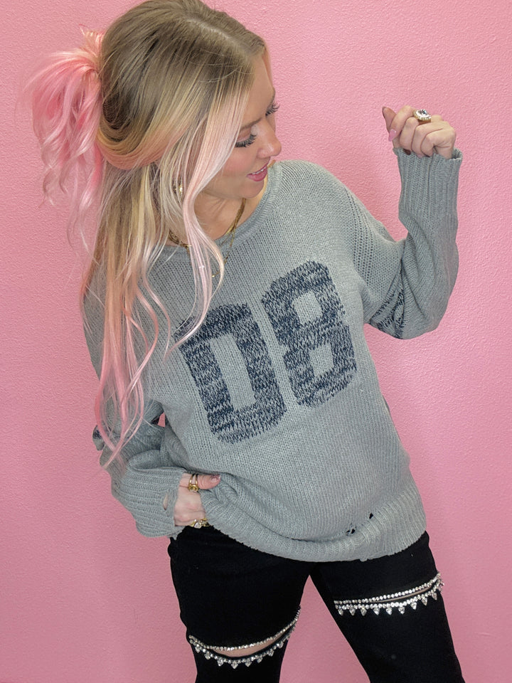 The Rebel Stripe Varsity Top