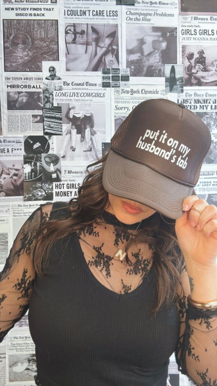Put It On My Husband's Tab Trucker Hat