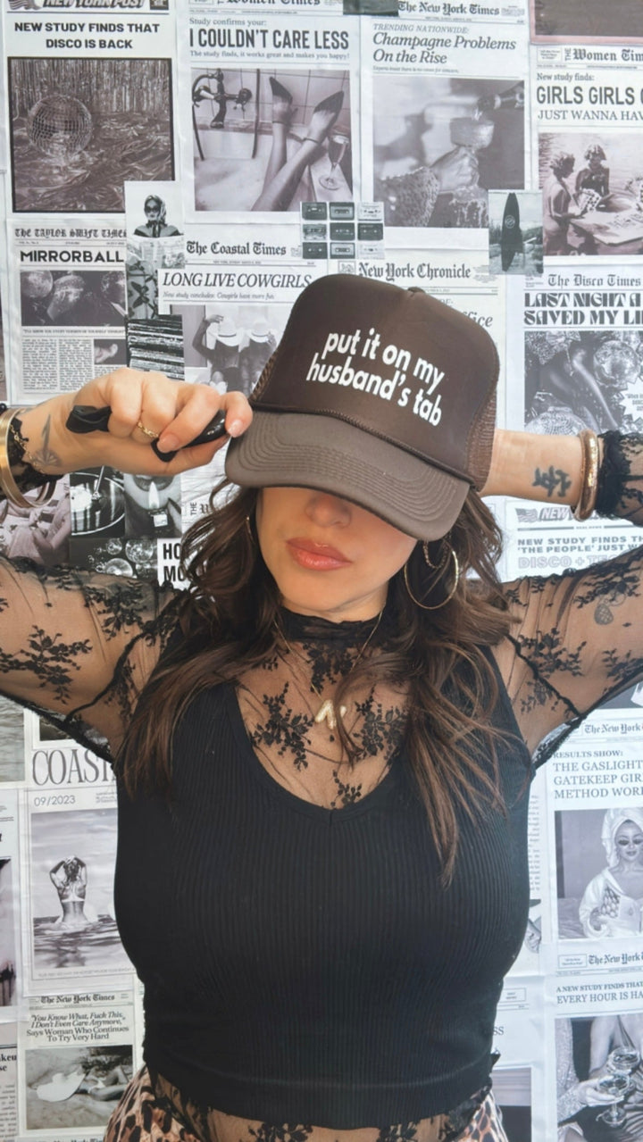 Put It On My Husband's Tab Trucker Hat